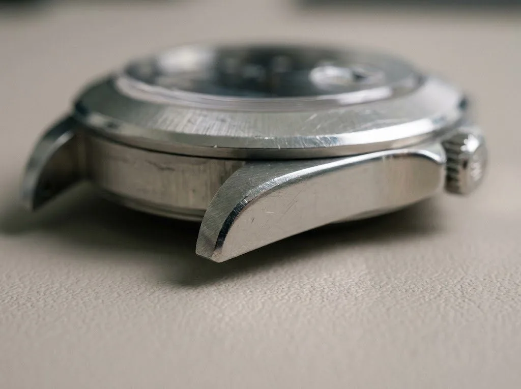 Close-up of an unpolished watch case showing sharp original lugs