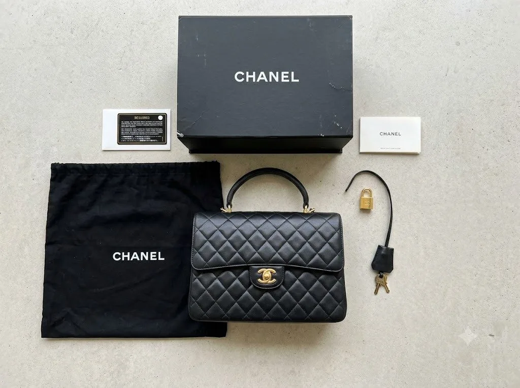 Designer handbag with dust bag, box, authenticity card and clochette